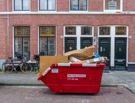 Construction site with builders removing waste